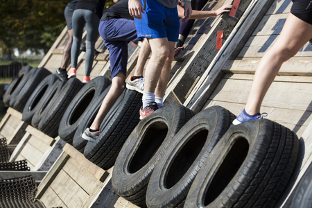 LONDON, UK - September 13th 2018: Participants take part in a Tough Mudder 5K obstacle race in London.のeditorial素材
