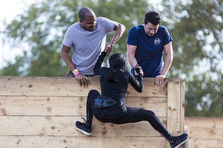 LONDON, UK - September 13th 2018: Participants take part in a Tough Mudder 5K obstacle race in London.のeditorial素材
