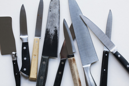 A variety of knives on a plain background. Knife crime conceptの写真素材