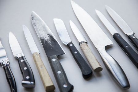 A variety of knives on a plain background. Knife crime conceptの写真素材