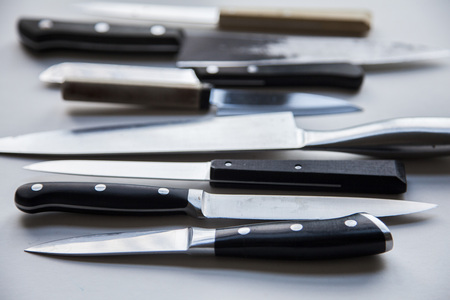 A variety of knives on a plain background. Knife crime conceptの写真素材