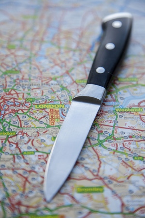 LONDON, UK - NOVEMBER 14th 2018: A knife on a map of London, England. Knife crime in London conceptのeditorial素材