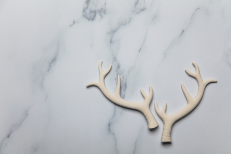 Christmas reindeer antlers on a marble backgroundの写真素材