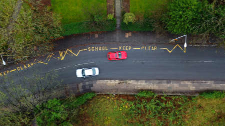 Aerial view of a school keep clear road sign in the UKの写真素材