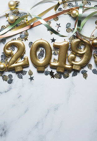 Happy new year 2019 gold background with confetti on a merble backgroundの写真素材