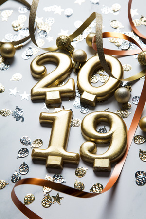 Happy new year 2019 gold background with confetti on a merble backgroundの写真素材