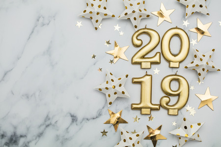 Happy new year 2019 with gold stars on a marble backgroundの写真素材