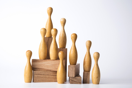 Business leadership concept. Wooden figures on blocksの写真素材