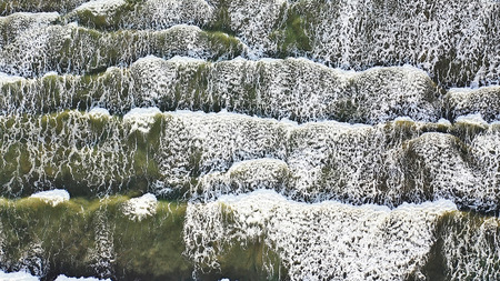 Aerial overhead view of beautiful breaking ocean wavesの写真素材