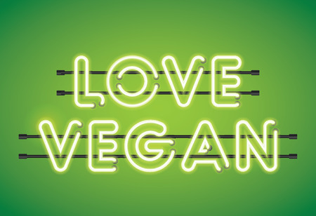 Love Vegan neon florescent lighting message on a green backgroundの写真素材