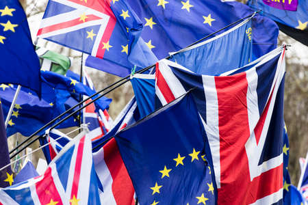 European Union and British Union Jack flag flying together. A symbol of the Brexit EU referendumの写真素材