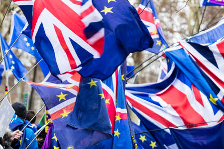 European Union and British Union Jack flag flying together. A symbol of the Brexit EU referendumの写真素材