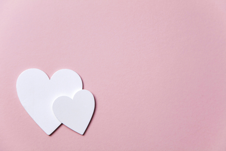 White hearts on a pastel pink background. Valentine's day, Mother's day backgroundの写真素材