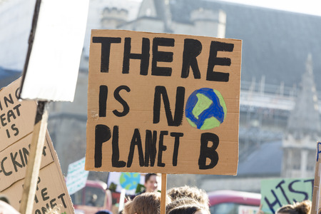 LONDON, UK - February 15, 2019: Protestors with banners at a Youth strike for climate march in central Londonのeditorial素材