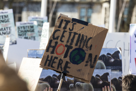 LONDON, UK - February 15, 2019: Protestors with banners at a Youth strike for climate march in central Londonのeditorial素材