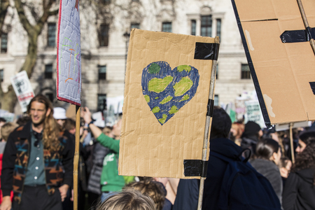 LONDON, UK - February 15, 2019: Protestors with banners at a Youth strike for climate march in central Londonのeditorial素材