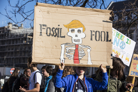 LONDON, UK - February 15, 2019: Protestors with banners at a Youth strike for climate march in...