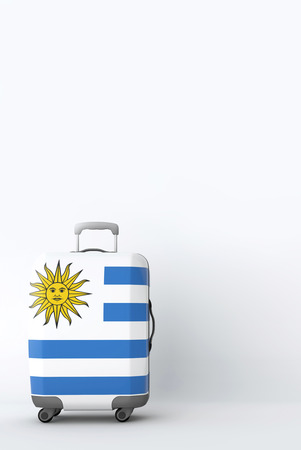 Travel suitcase with the flag of Uruguay. Holiday destination. 3D Renderの写真素材