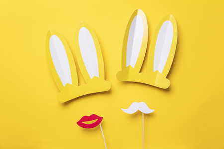 Mr and Mrs Easter bunny rabbits on a yellow backgroundの写真素材