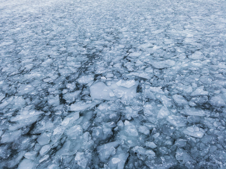 Cracked ice on the surface of the ocean. Global warming concept