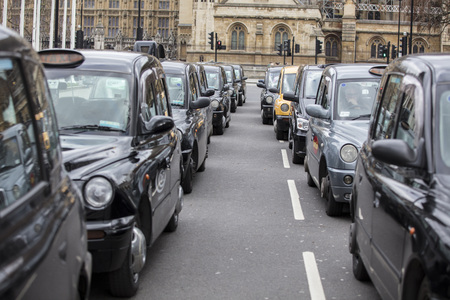 Taxis block roads in Westminster in protest