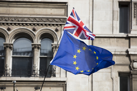 European Union and British flags fly together at an anti-Brexit political march