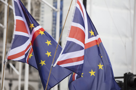 European Union and British flags fly together at an anti-Brexit political march