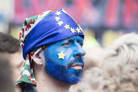 LONDON, UK - March 23rd 2019: People with European Union flag face paint at an anti Brexit marchのeditorial素材