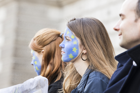 LONDON, UK - March 23rd 2019: People with European Union flag face paint at an anti Brexit marchのeditorial素材