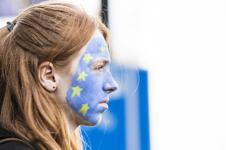 LONDON, UK - March 23rd 2019: People with European Union flag face paint at an anti Brexit marchのeditorial素材