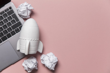Business startup concept. Rocket taking off with crumpled paper trailの写真素材