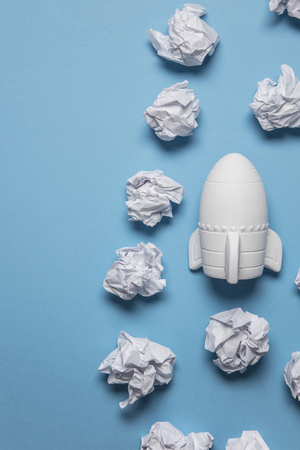 Business startup concept. Rocket taking off with crumpled paper trailの写真素材