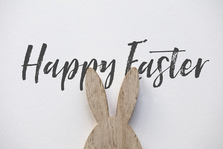 Wooden easter bunny ear message on a plain white backgroundの写真素材