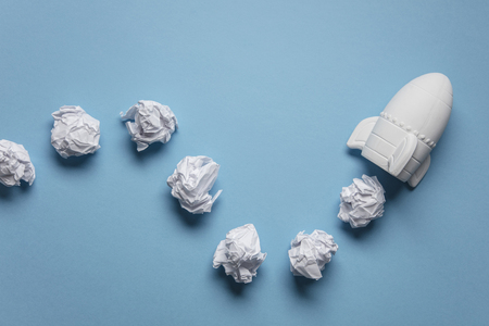 Business startup concept. Rocket taking off with crumpled paper trailの写真素材