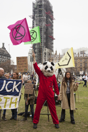 Extinction Rebellion protestors with banners and placards in Londonのeditorial素材