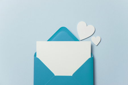 Fathers Day card mockup. Blue envelope blank white card and heartsの写真素材