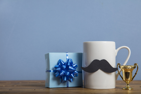 Fathers day present with a coffee mug and paper mustacheの写真素材