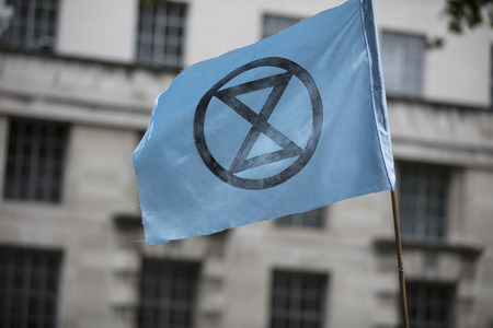 LONDON, UK - June 4th, 2019: Extinction Rebellion flags flying at a protest