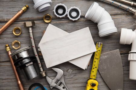 Plumbing tools and tiles. Home improvement background