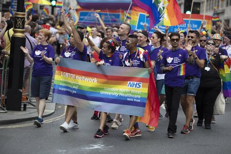 LONDON, UK - July 6th 2019: NHS staff members take part in the annual gay pride march in central...