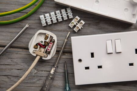 Electrical tools and equipment on a wooden backgroundの写真素材