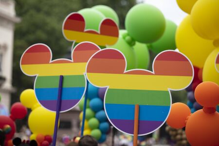 LONDON, UK - July 6th 2019: Disnry Micky Mouse icon with gay rainbow flag design at the annual gay pride march in central Londonのeditorial素材