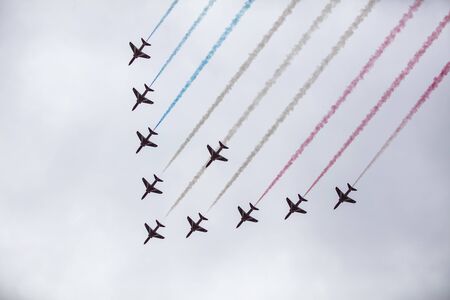 LONDON, UK - July 6th 2019: RAF Red Arrows flying in formation with smokeのeditorial素材