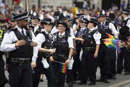 LONDON, UK - July 6th 2019: Police officers take part in the annual gay pride march in central...