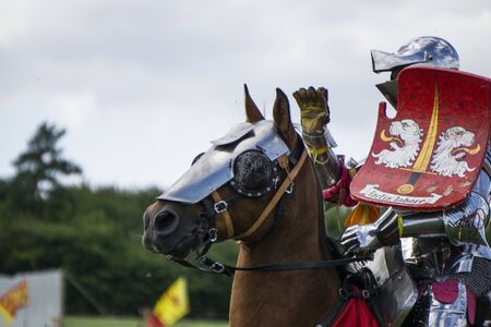 Brackley, UK - June 7th 2019: People dressed as medieval knights on horseback take part in a jousting competitionのeditorial素材