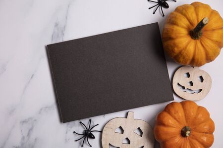 Blank black halloween poster with pumpkins and spidersの写真素材
