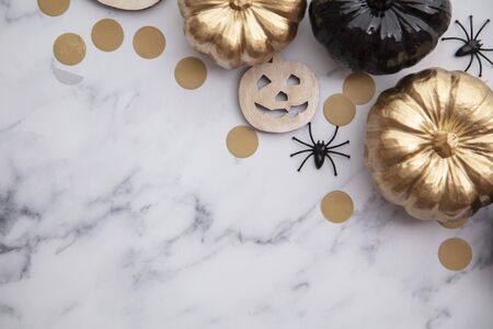 Halloween luxury gold and black pumpkin flat lay background compositionの写真素材
