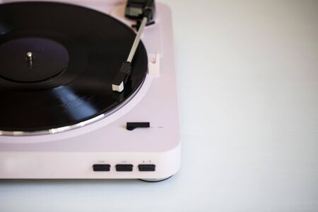 Vintage music record player with a vinyl recordの写真素材