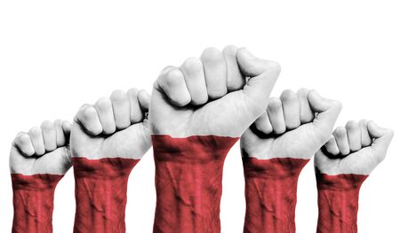 A raised fist of a protesters painted with the Poland flagの写真素材