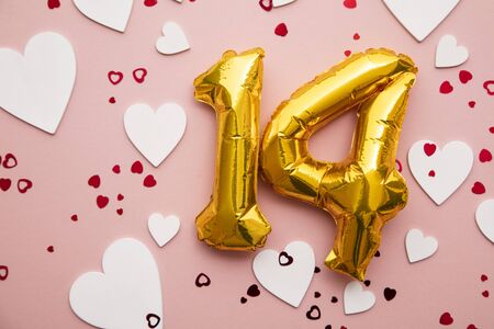 February 14th. Valentines day gold foil balloon backgroundの写真素材